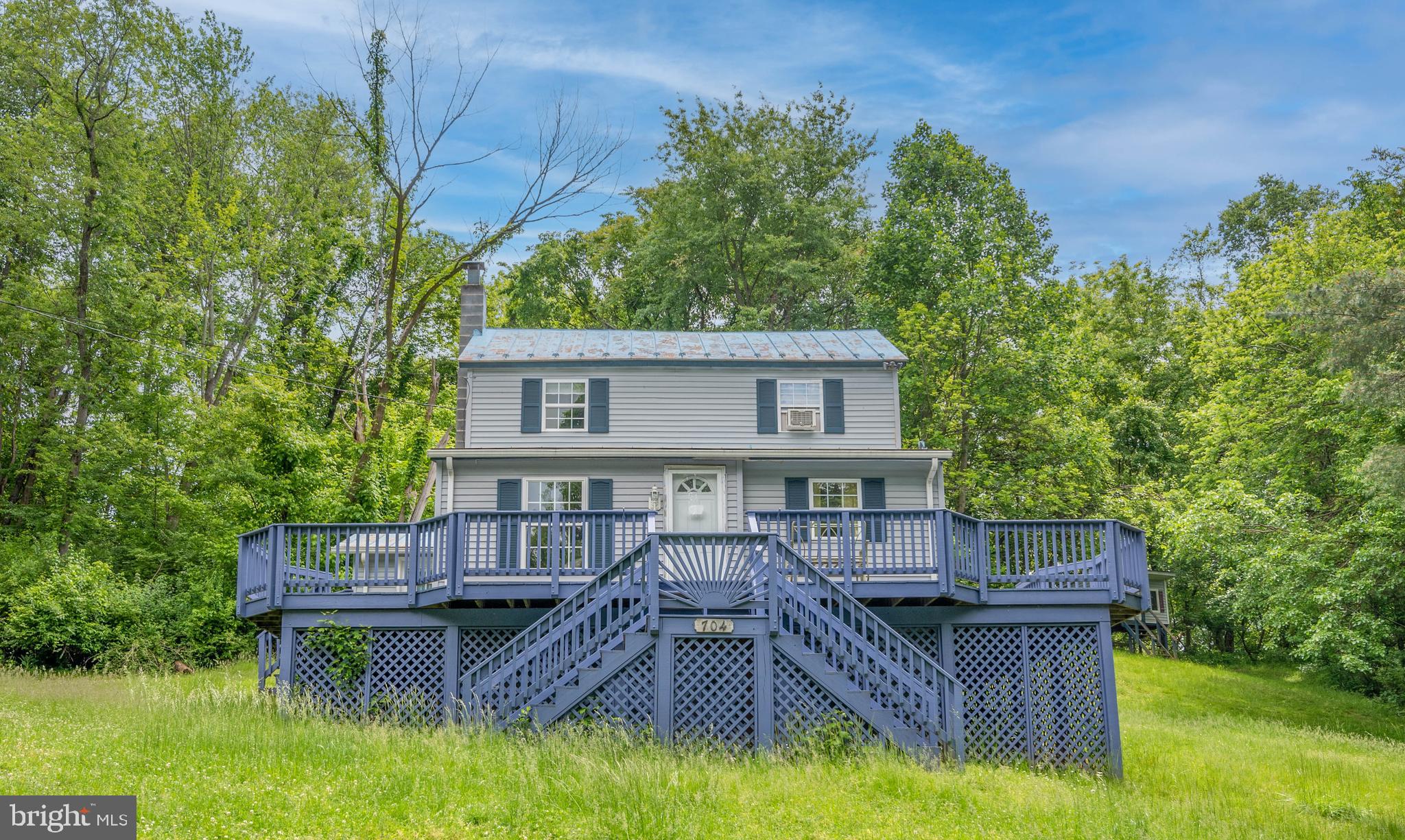 List price is Opening Bid Only At The Online Auction Sale - Bidding begins Saturday, June 3rd & ends Thursday, June 8, 2023 @ 1:00pm. **Renovation Opportunity** Detached Colonial Style Porch-Front House, Includes Multiple Outbuildings, on a Private & Secluded 0.68± Acres in Brunswick, Frederick County. The home includes 1,384± total square feet, 2 bedrooms, 1 full bath, and multiple outbuildings. The main level of the home includes living room, kitchen, a dining room, and full bath. The upper level includes 2 bedrooms. Features include a large wrap-around deck, wood floors throughout the main level, driveway with ample parking, and a totally private backyard overlooking trees. The home is in need of TLC but and has tremendous potential.
