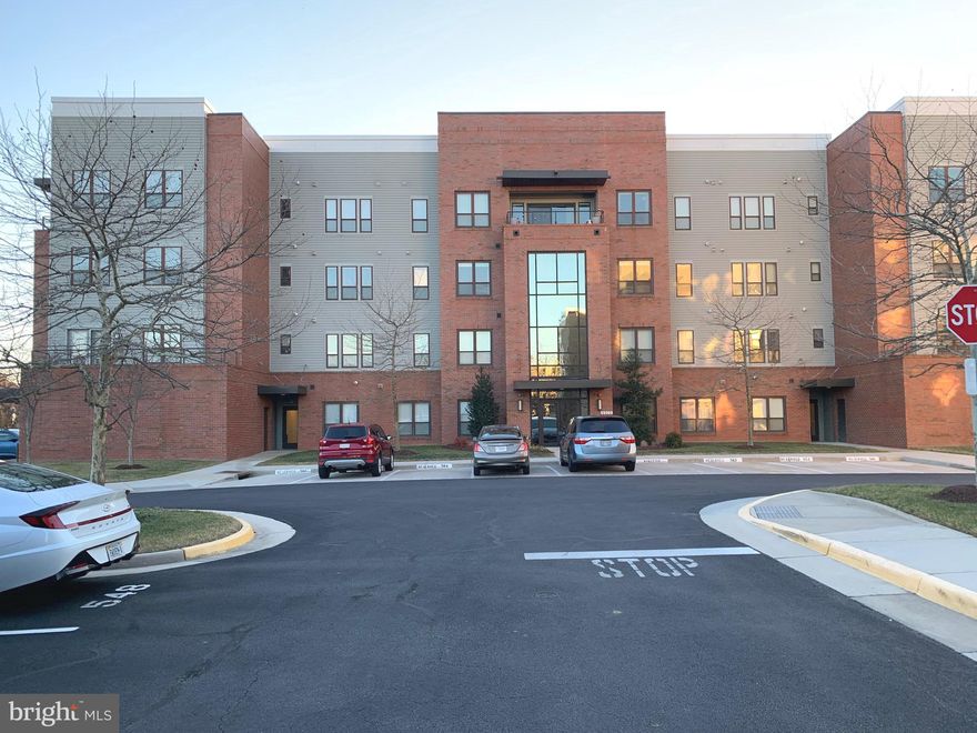 Welcome home to resort-style 55+ luxury living at sought-after Spring Hill, an award-winning, gated community where comfort, convenience, and elegance come together. This beautifully maintained first-floor condominium offers effortless accessibility with no stairs or elevators and enjoys a prime location just steps from the lobby and your assigned parking space, making daily living and deliveries easy and stress-free.
Inside, a bright and open two-bedroom, two-bath floor plan creates an inviting atmosphere filled with natural light. Large windows in the living room and both bedrooms showcase peaceful views of surrounding open green space. Step outside to your private patio overlooking a lush lawn, the perfect spot for morning coffee or evening relaxation.
The freshly painted interior enhances the home’s open-concept design, featuring a cozy living room with a fireplace, a traditional dining area with crown and chair rail molding, and abundant storage throughout. The spacious eat-in gourmet kitchen is equipped with rich wood cabinetry, ceramic tile flooring and backsplash, stainless steel appliances—including a three-door refrigerator, built-in microwave, and dishwasher—a stainless steel double sink, and a pantry for added storage.
The generous primary suite offers two closets, including a large walk-in, and a spa-inspired en-suite bath with granite finishes, a glass shower with built-in bench, a jetted soaking tub, and elegant ceramic tile flooring. A large second bedroom that offers flexibility for guests or a home office. There is also a large second full bath with the same upgraded finishes as the primary bathroom.
Additional features include a dedicated laundry room with large-capacity washer and dryer, a well-maintained gas furnace, and a climate-controlled storage unit within the building. Move-in ready and meticulously cared for, this home delivers the perfect blend of luxury, accessibility, and comfort in one of the area’s most desirable active adult communities—ideal for both everyday living and entertaining.
Spring Hill is a vibrant, park-like community offering an impressive array of amenities and an unbeatable location. Residents enjoy a stunning clubhouse with a heated indoor pool and jacuzzi spa, fully equipped fitness and exercise center, billiards and game rooms, dance and social rooms, and an elegant banquet ballroom for private events. Outdoor amenities include tennis and bocce courts, scenic bike and jogging trails, a large gazebo, covered patio areas, expansive green spaces, and a playground perfect for visiting grandchildren.
The community is located next to the Laurel Hill Golf Course, giving you easy access to great golf and beautiful natural views. Just a short walk away, Liberty Marketplace has a Lidl grocery store, plus plenty of local shops and restaurants to explore.
Commuter-friendly amenities include nearby VRE commuter train service and bus routes, providing easy transportation to surrounding areas while still enjoying a peaceful, resort-style setting. A lively social calendar brings neighbors together with organized events, bridge, bunco, mah-jongg, poker, game nights, and monthly potluck dinners.