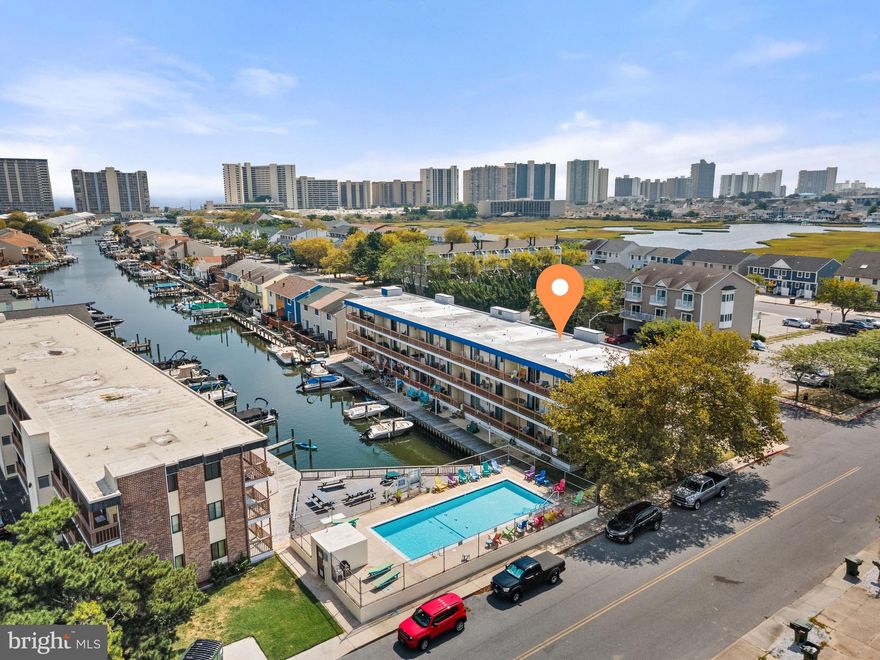 Bright and sunny 2 bedroom 2 bath canal-front end unit.  Bring your boat or jet skis... Boat slips are only 100$ a year (NO WAITLIST)!  Private community pool and sweet picnic area right on the water.  The pool was resurfaced and painted in 2021 and the picnic area adjacent to the pool also received all new composite decking and all new picnic tables.  This spacious home sleeps 6-8 comfortably and has received many tasteful updates: New LVP flooring throughout (2022), All rooms freshly painted (2022), New trim work (2022),  Completely renovated main bathroom (new toilet, re-glazed tub, new plumbing for tub, new tile, new vanity, new shiplap ceiling) (2022).  The kitchen cabinets and appliances were also replaced within the last 5 years.  There is even an exterior storage closet for your sandy beach toys.  Windward Landing South is in the perfect uptown location just off of Jamestown Rd.  The *Original* Greene Turtle is just down the street along with shopping, groceries, the movies, and of course, the BEACH.