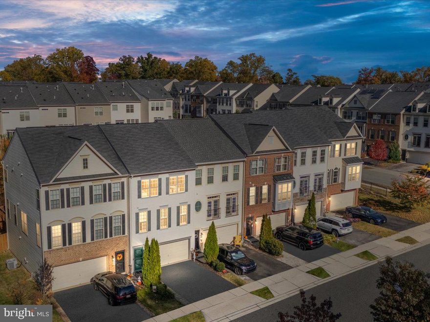 Welcome to this stunning 3-story garaged town home in Arnold's desirable Canterbury Village   minutes to Annapolis and  Naval Academy.  A well-appointed 2,480 SF built in 2014 featuring 3 bedrooms + a bonus bed/office room, 2 full and 2 half bathrooms, this home has been meticulously maintained and updated with new luxury vinyl plank flooring!  The gourmet kitchen has plentiful beautiful white custom cabinetry, updated stainless appliances, double oven/gas cooking, a must have pantry, a spacious granite island with room for seating and, walk out to the deck for quick access to the grill!  Enjoy the light and airy feeling with the tall windows and ceilings accented by custom crown molding and recessed lighting.  The main level provides two spaces for living and dining accented by a beautiful natural gas fireplace w/mantel and window blinds, along with a half bath and a comfortable open concept with distinctly separate spaces!  Upstairs you’ll find a spacious primary suite with walk-in closet and oversized bathroom complete with double vanity, walk-in shower and water closet for privacy.  Two additional bedrooms and a full bathroom (also double vanity) are found upstairs.   Stairs were carpeted in 2022.  A 4th bedroom or office can be found on the lower level along with a half bath and another living space making this a perfect guest suite (the Murphy bed conveys!).   Walk-out to the covered custom paver patio and fenced-in back yard with maintenance free turf(!), and direct access to the oversized 2-car garage!  Canterbury Village is a beautiful community of 130 Single Family and Luxury Townhomes in an amazing location on the Broadneck Peninsula, minutes from sought-after Arnold schools and a short drive to the Chesapeake Bay, Annapolis/Naval Academy and a short commute to Washington DC or the Ft. Meade/BWI area.   This is a charming neighborhood with easy access to local attractions, shopping, dining and state parks.  Community amenities include two playgrounds and sidewalks.  This is a must see home!  Schedule your private showing today and be the first to be impressed!