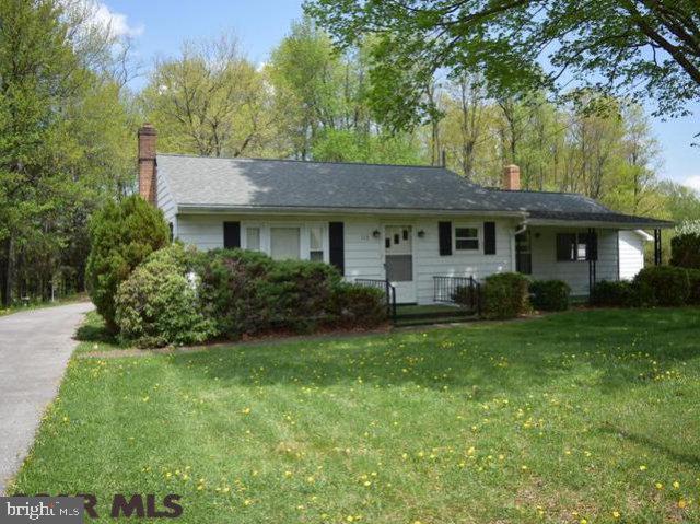 Sizeable ranch home on a double lot of 1.4 acres with fruit trees, nice large yard, some wooded area and just minutes from I-80. Home has new replacement windows, hardwoods in living, large family room with great views from picture windows and brick fireplace with gas insert or wood fireplace as desired. Extra large 2-car garage 22'x27' with paved driveway and large paved parking area in rear. Basement had been finished with full bath, just select your flooring and you've increased your living space greatly. Great setting, affordable payments, taxes, and utilities. Call quickly!