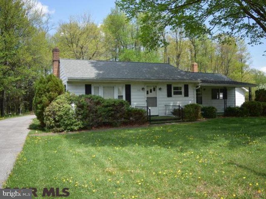 Sizeable ranch home on a double lot of 1.4 acres with fruit trees, nice large yard, some wooded area and just minutes from I-80. Home has new replacement windows, hardwoods in living, large family room with great views from picture windows and brick fireplace with gas insert or wood fireplace as desired. Extra large 2-car garage 22'x27' with paved driveway and large paved parking area in rear. Basement had been finished with full bath, just select your flooring and you've increased your living space greatly. Great setting, affordable payments, taxes, and utilities. Call quickly!