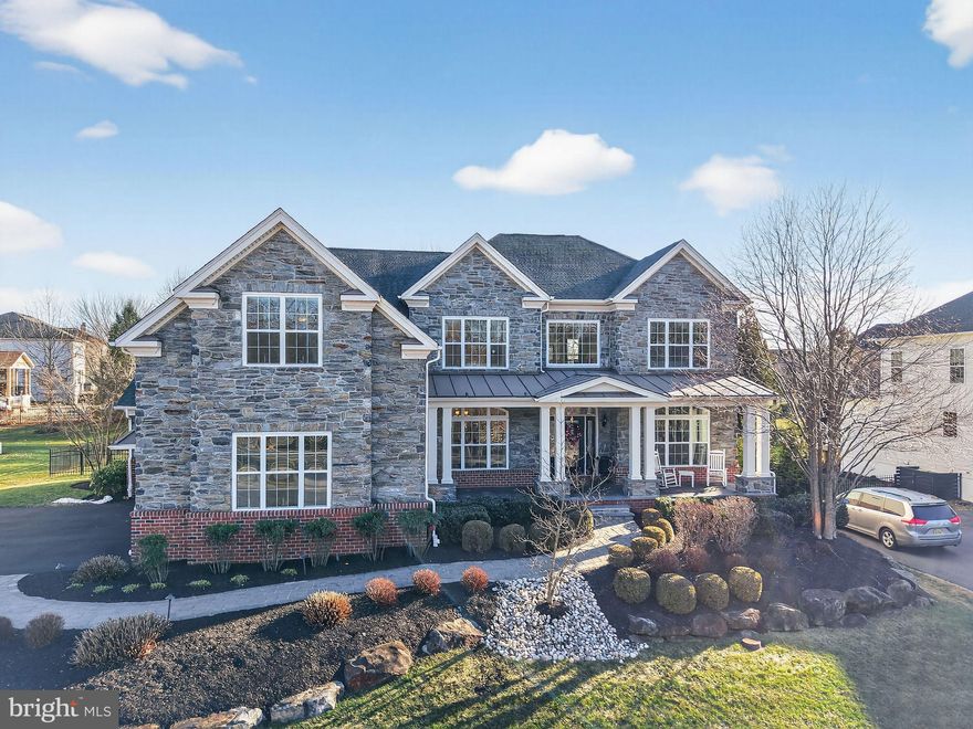 Exciting opportunity to own an exceptional  Duke Carolina model in Greenville Overlook, an upscale development conveniently situated near food, dining, and shopping in a private subdivision. The home is located conveniently at the entrance on a premium well-lit, landscaped, and fenced- in lot. This home is loaded with beautiful structural and material upgrades on all three levels. With a stone, brick and composite exterior,  full length flagstone front covered porch, and a flagstone rear patio with an outdoor fireplace and ample room for grilling and entertaining. 5 bedrooms, 5.5 upgraded and fully tiled baths, A premium primary suite with sitting room/office, dressing area, 3 walk in closets and luxury bath. Princess suite and 2 additional bedrooms sharing a Jack and Jill bath as well as a balcony landing complete the second floor. The first level offers a library/office/formal living with built-ins and wet bar, a great room with gas fireplace and soaring coffered ceiling,  an upgraded kitchen with massive island, top of the line appliances and upgraded staggered cabinets. Formal dining room, guest suite, laundry, walk-in pantry, Upgraded woodwork and hardwood flooring. Finished lower walk out basement with full-sized bar, exercise room, full bath, additional height on ceilings and plenty of storage, offer the ultimate entertainment area, in-law suite, man-cave, or teenage retreat.  This home is completed with a 4-car garage and updated HVAC systems, new garage door openers, and mailbox. The possibilities for this home are endless. Visit today…you will not be disappointed.