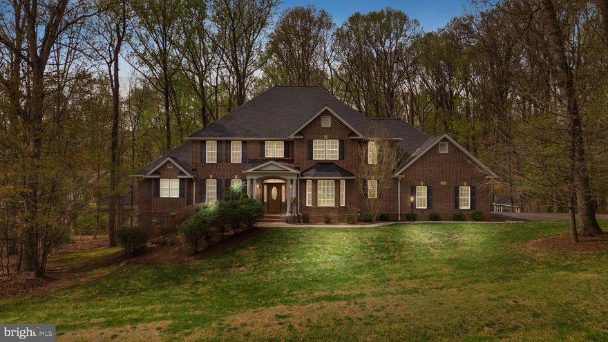 Your dream home awaits! Quietly nestled on a beautiful cul-de-sac with lush and mature treed site this exquisite custom-built estate has been well-maintained and shows like new. The exterior finish is all brick, with new 50-year GAF timberline HDZ architectural shingle roofing, and newer HVAC, while the interior offers a primary bedroom with an on-suite bathroom on the main level, a second bedroom with en-suite bathroom and two bedrooms on the upper level that share a bathroom, as well as a fifth bedroom with a full bathroom in the finished basement. The main level features hardwood floors on the entire first floor with tile in the primary bathroom and laundry room. The foyer opens into a spectacular Great Room that has a large gas fireplace and double-stacked windows. The gourmet kitchen has a large center island with vegetable sink and dishwasher, an additional counter with double sinks and a second dishwasher, beautiful granite countertops, cherry cabinets, 48-inch pro-gas cooktop, pot filler, double ovens, warming drawer, 48-inch refrigerator, and walk-in pantry with plug for a cordless vacuum. The dining room and study have crown molding and chair rail trim work. The eat-in kitchen has a sliding door to adjoin the upper Trex deck. The main floor Primary Bedroom has two walk-in closets, a fireplace, French door to the deck and the Primary Bathroom offers a shower and garden soaking tub. The side-entry true 3-car garage has 3 storage closets with shelving, hot and cold water, and numerous outlets to accommodate an EV. The finished basement offers a full bath, bedroom, movie theatre with 7.1 surround sound, full kitchen, fireplace, 2nd laundry room with washer, dryer, sink, upright freezer, recessed accent lighting, speaker system with multiple zone music selection, and exercise room with Precor elite runner treadmill, elliptical, recumbent bike, and Precor 4 station weight system. Fitness equipment and pool table convey with the sale of the home. The finished basement opens to a 1,300 sq. ft. E. P. Henry Devon stone patio installed on top of a 5-inch concrete underlayment for structural integrity. Just outside the basement area is a shed storage area. Other features offered by this home include recessed lighting, a central vacuum, a pre-wired speaker system on the main floor, insulated tilt-in windows throughout the entire home, gutter guards, and many more.