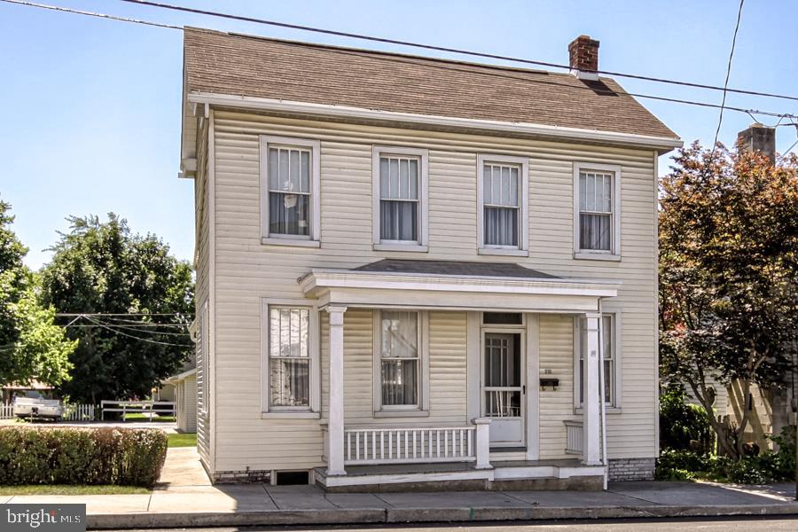 On this beautiful large double lot in town sits a 3BR 1.5 BA 2 story home waiting just for you! Lots of yard & space for gardening. Baseboard hot water heat fired by a Weil McClain furnace w/economical natural gas. Other features include: new 200 AMP electric service & panel box. Walk up attic for storage, 1st flr laundry. Walk to elem & high school, pool, & park or downtown. 2 car gar plus off street & on street parking. New shingled roof in 08. You're going to love this lot & the benefits of living here!