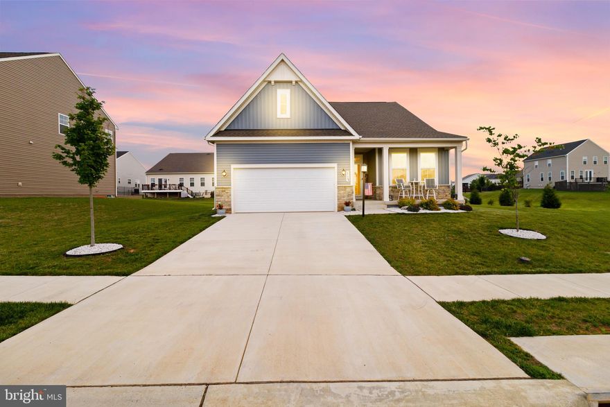 This stunning corner lot Rancher with 4 bedrooms and 3 full baths offers a finished basement in the most desirable, Charles Town neighborhood of Norborne Glebe.   Don't wait for a new build when this immaculate, move-in-ready home with over $120,000 in upgrades could be yours now!  The 1.5-year-old, Lexington model rancher, built by Lennar Homes is situated on a premium corner lot. The property offers a blend of modern amenities and classic charm.  The exterior and outdoor living features offer a beautiful, exterior with a porch, a brand new Trex deck with vinyl railing, and beautiful extensive landscaping surrounding the home. Inside, you will find an open-plan layout connecting the Great Room, a beautiful upgraded farmhouse package kitchen with Alpine Valley granite countertops, Duraform Harbor cabinets, a breakfast room,  and a separate dining area.  This home is Immaculate and super clean throughout! Upgraded include, new ceiling fans, window blinds, storm doors, new high-end Culligan water softener,  and a washer & dryer.  The luxury owner’s suite with a huge walk-in closet and secondary bedroom are on opposite corners for added privacy. The formal dining room is off the foyer, ideal for meals on every occasion. The secluded 3rd bedroom, currently used as a home office, is perfect for remote work. The fully finished basement offers a 4th bedroom, full bath, huge recreation room, and rough-in for a bar. Another 770 sq. feet of additional unfinished basement space for storage!  Norborne Glebe is a master-planned community with amenities including, an in-ground swimming pool with a bathhouse, green space, and play area.  Prime location with quick access to shopping, dining, recreation, and historic sites. Only eight miles from the MARC station for convenient commuting and conveniently located to VA & MD.  Starting next month HOA fee includes trash removal!