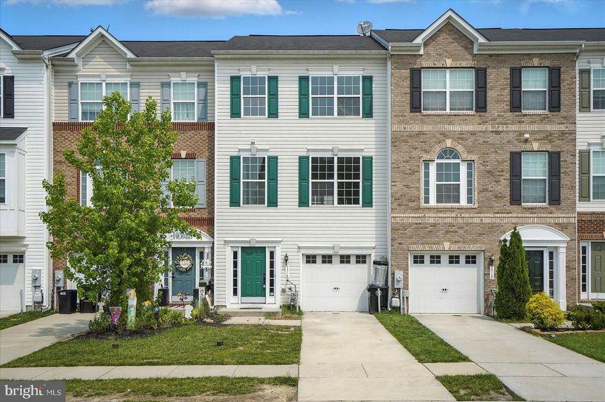 Stunning fully renovated 3 story TH with attached garage in the highly sought after Admirals Landing neighborhood of Dundalk! This home boasts 3 finished levels and nearly 2,000 SF perfect for any family to move right in! This home features brand new LVP flooring throughout the first and second floors. The first floor includes a bedroom with walk out access to the rear yard, laundry room, and access to your garage. The second level of the home is an open concept featuring the Kitchen, Dining Room, Powder Room, Living Room with recessed lighting and a walk out to the rear composite deck. The kitchen has been totally redone with all new grey cabinetry, a massive eat in island with high end quartz countertops and stainless steel appliances. The living room includes a custom accent wall spanning the entire length of the room sure to impress you and your guests! The 3rd level includes 3 spacious bedrooms with ample closet space and 2 full bathrooms. The primary suite is top notch with a dual sink vanity and a brand new custom shower with a beautiful floor to ceiling tile design! The custom shower glass door and mirror for this bathroom will be installed prior to settlement! The secondary hall bathroom is perfect for children and / or your guests. Homes like this one do not come along often! Schedule your showing to see this beauty today!