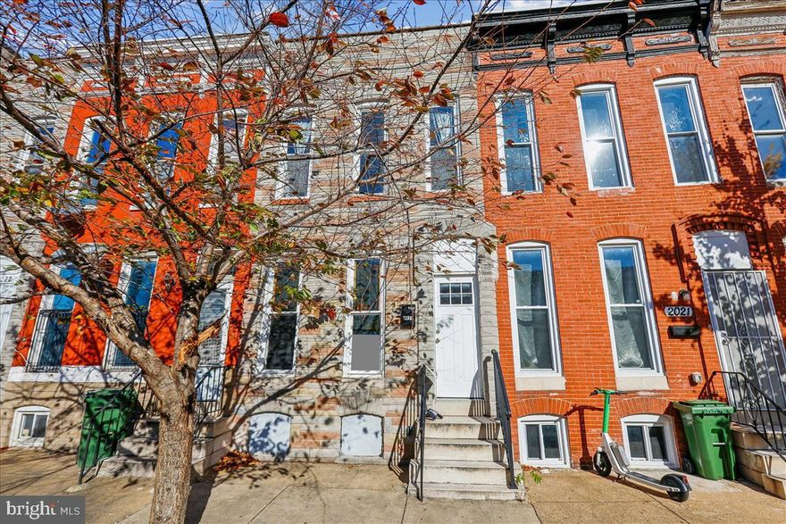Step into this beautifully renovated 3-level rowhome where classic character meets modern design. Featuring 4 bedrooms, including a convenient main-level bedroom, and 1.5 thoughtfully updated baths, this home perfectly balances comfort and style. The main level invites you in with an open and inviting living space centered around a cozy fireplace — ideal for relaxing evenings or hosting guests. The modern kitchen features brand-new stainless-steel appliances, sleek countertops, and contemporary finishes that make cooking a delight. Upstairs, you’ll find three spacious bedrooms filled with natural light and a luxuriously renovated full bath showcasing elegant tilework and fixtures. The unfinished lower level offers endless potential — create a home gym, speakeasy-style lounge, playroom, or extra storage space to fit your lifestyle. Out back, enjoy a private fenced yard perfect for weekend BBQs, morning coffee, or your own peaceful garden retreat. Ideally located near trendy shops, local cafes, popular restaurants, and convenient public transit, this home delivers both neighborhood charm and city convenience. Move right in and fall in love with Baltimore living!