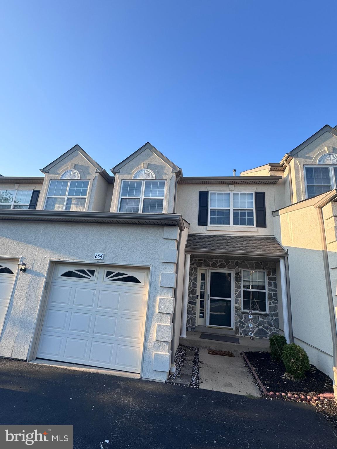 Beautifully updated and generously sized townhome nestled in the highly desirable Deer Creek community! Enjoy the prime location just minutes from the shopping and dining options of King of Prussia. This home offers 3 spacious bedrooms plus a large, finished loft—ideal as a 4th bedroom, home office, or flex space.
Step inside to discover newer hardwood flooring throughout the main level, which features an open-concept layout including a welcoming foyer, living room, and dining area. A double-sided gas fireplace adds cozy ambiance to both living and dining spaces.
The modern kitchen boasts a large center island with sleek new stone countertops, bar seating, a stylish subway tile backsplash, and an adjacent breakfast nook—perfect for casual dining.
Upstairs, the impressive primary suite showcases a cathedral ceiling, walk-in closet, and an elegant en-suite bathroom with a soaking tub, stall shower, and dual vanities. Two additional bedrooms, a full hall bath, and a convenient laundry area complete this level.
The bright, finished walkout lower level includes a powder room, plenty of storage, and sliding doors that lead to the outdoors. Additional highlights include an attached 1-car garage with interior access, driveway parking for two more vehicles, a security system, and a deck just off the kitchen—great for outdoor entertaining.