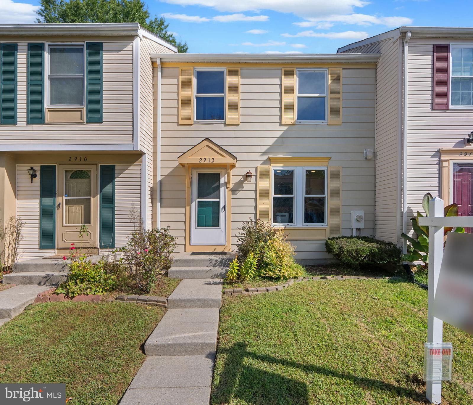 Stylish townhouse residence offering 1,680 square feet with 3 bedrooms and 2 full baths in the desirable Oak Pond community. The main level welcomes you with a foyer that opens to a bright, open-concept living and dining area featuring gleaming floors and sliding glass doors leading to the back patio. A convenient pass-through window connects the space to the modern eat-in kitchen, which showcases dual-tone cabinetry with white uppers and black lowers, stainless steel appliances, gold fixtures, striking countertops, and a sunny breakfast area. Upstairs, three spacious bedrooms provide comfortable retreats, including a generously sized primary, along with a full bathroom. The walk-up lower level expands the living space with a versatile family room—perfect as an additional living area, media room, or entertaining space—alongside a second full bathroom and a storage room with laundry facilities. Outdoors, the fenced backyard offers a brick patio and thoughtful landscaping, ideal for relaxing or entertaining. Two assigned parking spaces complete this move-in-ready home.