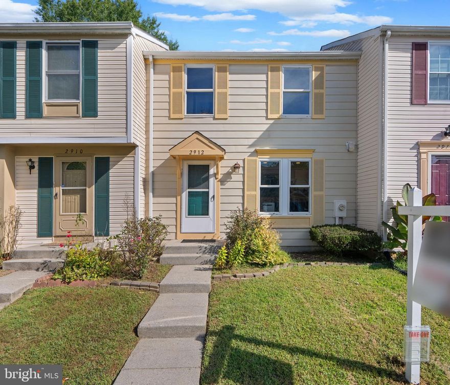 Stylish townhouse residence offering 1,680 square feet with 3 bedrooms and 2 full baths in the desirable Oak Pond community. The main level welcomes you with a foyer that opens to a bright, open-concept living and dining area featuring gleaming floors and sliding glass doors leading to the back patio. A convenient pass-through window connects the space to the modern eat-in kitchen, which showcases dual-tone cabinetry with white uppers and black lowers, stainless steel appliances, gold fixtures, striking countertops, and a sunny breakfast area. Upstairs, three spacious bedrooms provide comfortable retreats, including a generously sized primary, along with a full bathroom. The walk-up lower level expands the living space with a versatile family room—perfect as an additional living area, media room, or entertaining space—alongside a second full bathroom and a storage room with laundry facilities. Outdoors, the fenced backyard offers a brick patio and thoughtful landscaping, ideal for relaxing or entertaining. Two assigned parking spaces complete this move-in-ready home.