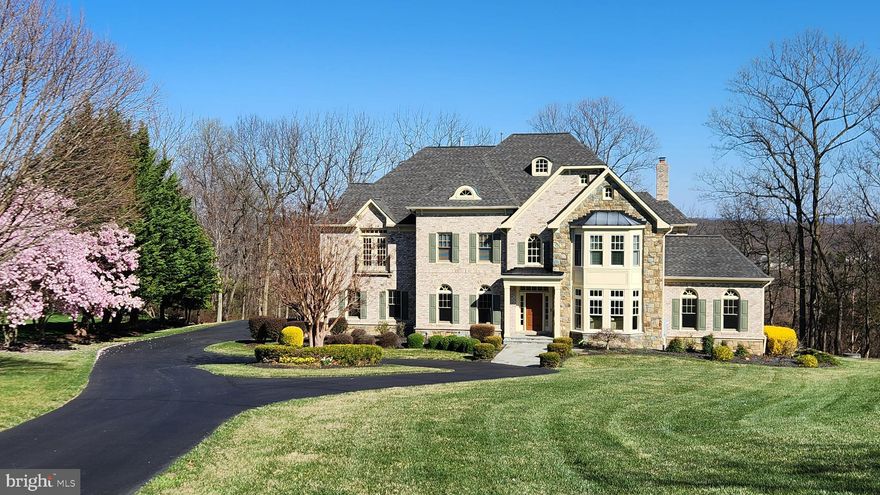 Set on a picturesque three-acre estate with captivating views of Sugarloaf Mountain, this elegant Renaissance Grand Rembrandt offers over 7,500 square feet of refined living. A circular drive leads to timeless architecture and thoughtfully designed spaces that blend sophistication with comfort. Inside, a sweeping staircase, gleaming hardwoods, and sun-filled rooms welcome both grand entertaining and everyday luxury. The gourmet kitchen flows seamlessly into a charming breakfast room and an additional sunroom, creating an inviting space to gather or savor morning light. The expansive deck provides the perfect backdrop for al fresco dining or quiet moments surrounded by nature. The finished lower level includes a wet bar, a versatile bonus room, and a full bath—ideal for guests, recreation, or a home gym. Four ensuite bedrooms offer private retreats, including a serene primary suite with sitting room, fireplace, and spa-inspired bath. A true Beacon Hill gem where elegance, nature, and craftsmanship unite in perfect balance.