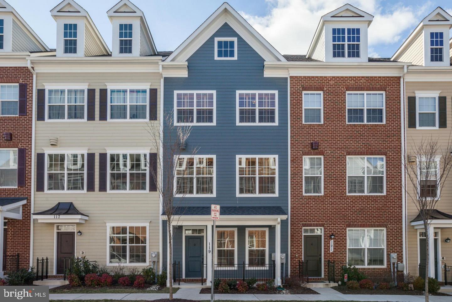 Welcome to 119 Meridian Lane, a beautifully maintained townhome conveniently located in the highly sought-after Towson Green community. Offering over 2,500 square feet of well-designed living space, this home features 4 bedrooms, 2 full bathrooms, 2 half bathrooms, and a 2-car garage, combining modern comfort with urban convenience. The entry level includes a flexible room that can serve as a home office or 4th bedroom, a half bath, and direct access to the 2-car garage. Upstairs, the main level features brand-new LVP flooring, an open-concept living and dining area, and a gourmet kitchen complete with granite countertops, stainless steel appliances, a center island, and ample cabinetry. Step outside from the kitchen to your private balcony, ideal for unwinding. The third level also features new LVP flooring and includes 3 generously sized bedrooms, 2 full bathrooms, and laundry for added convenience. The primary suite boasts a private ensuite bathroom. On the fourth level, enjoy a spacious recreation room, perfect for a media space, home gym, or additional living area, with direct access to your private rooftop deck, a serene spot to relax or entertain. Additional storage space completes this level. Custom plantation shutters throughout the home add both charm and functionality, enhancing the overall appeal. This stunning home combines space, style, and location, just minutes from Towson’s best dining, shopping, and commuter routes. Don’t miss your chance to make it yours!