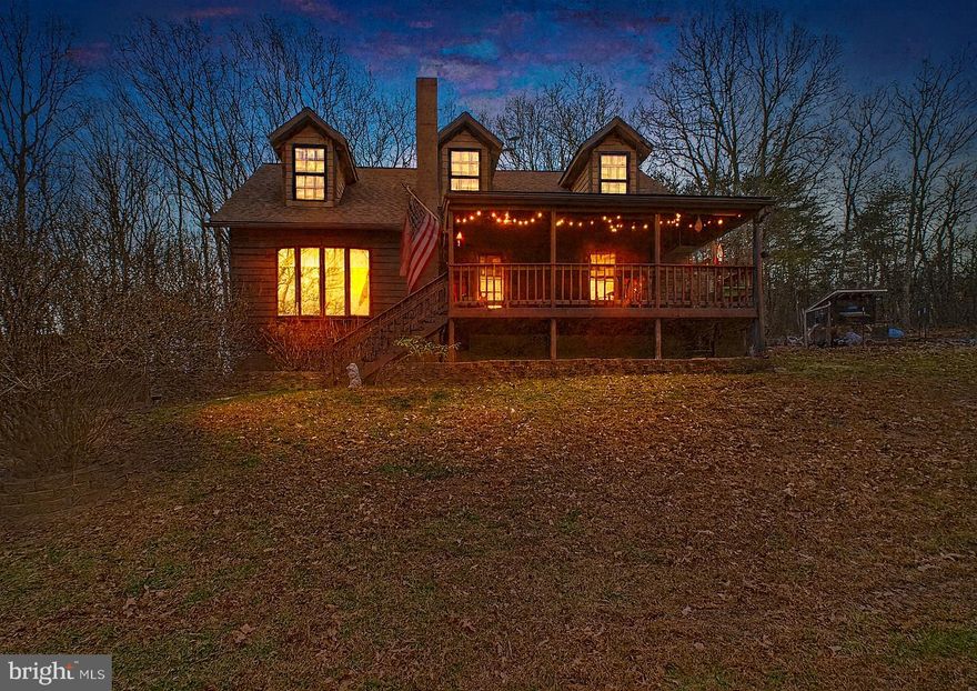 Nestled in the quiet area of South Berkeley County, this charming Cape Cod home offers a perfect blend of comfort and craftsmanship. With 3 bedrooms and 2 full baths, the interior features a traditional floor plan adorned with exposed beams and an upgraded and unique kitchen area dressed in a charming country home esque. It boasts stainless steel appliances, a double oven and a cozy breakfast area, seamlessly connecting to the brand new family room addition, ideal for gatherings or it's current use as a school house. Enjoy the warmth of the free-standing wood stove on chilly evenings. Set on a generous 4.81 +/- acre lot (4 total lots,) the property backs to lush trees, providing a private retreat with stunning mountain views. The exterior features a welcoming porch, secure storage, and play areas, perfect for outdoor enjoyment. A heated and secure outdoor office area allows one to focus on their work in seclusion. Conveniently located near Rt45, I-81 and commuter lots, this residence combines tranquility with accessibility. Experience the unique charm and inviting atmosphere that makes this property a true home. Did I mention to bring the chickens and horses?