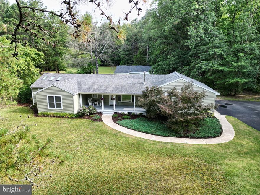 Wow!! Total transformation at this awesome house.  Completely gutted in 2019.  Sit on the front porch or the rear screened in porch and enjoy the wildlife.  Large kitchen/dining area with skylights for that natural light.  Cabinets are custom made with soft close doors.  There is a kitchen island that boosts quartz countertops. Coffee bar area in the kitchen.  Barn door in the laundry room with cabinets.  There are wood floors and tile floors throughout.   Located on a double lot within walking distance to  Martinak State Park.  Oversized side load garage with lots of storage.  20x35 outbuilding with electric that also has a barn door to use as a workshop or game room.  Outbuilding also includes a small front porch.  Raised planter box with seating on one side.  Pavers off of the screened in porch area.  Hot tub is negotiable.