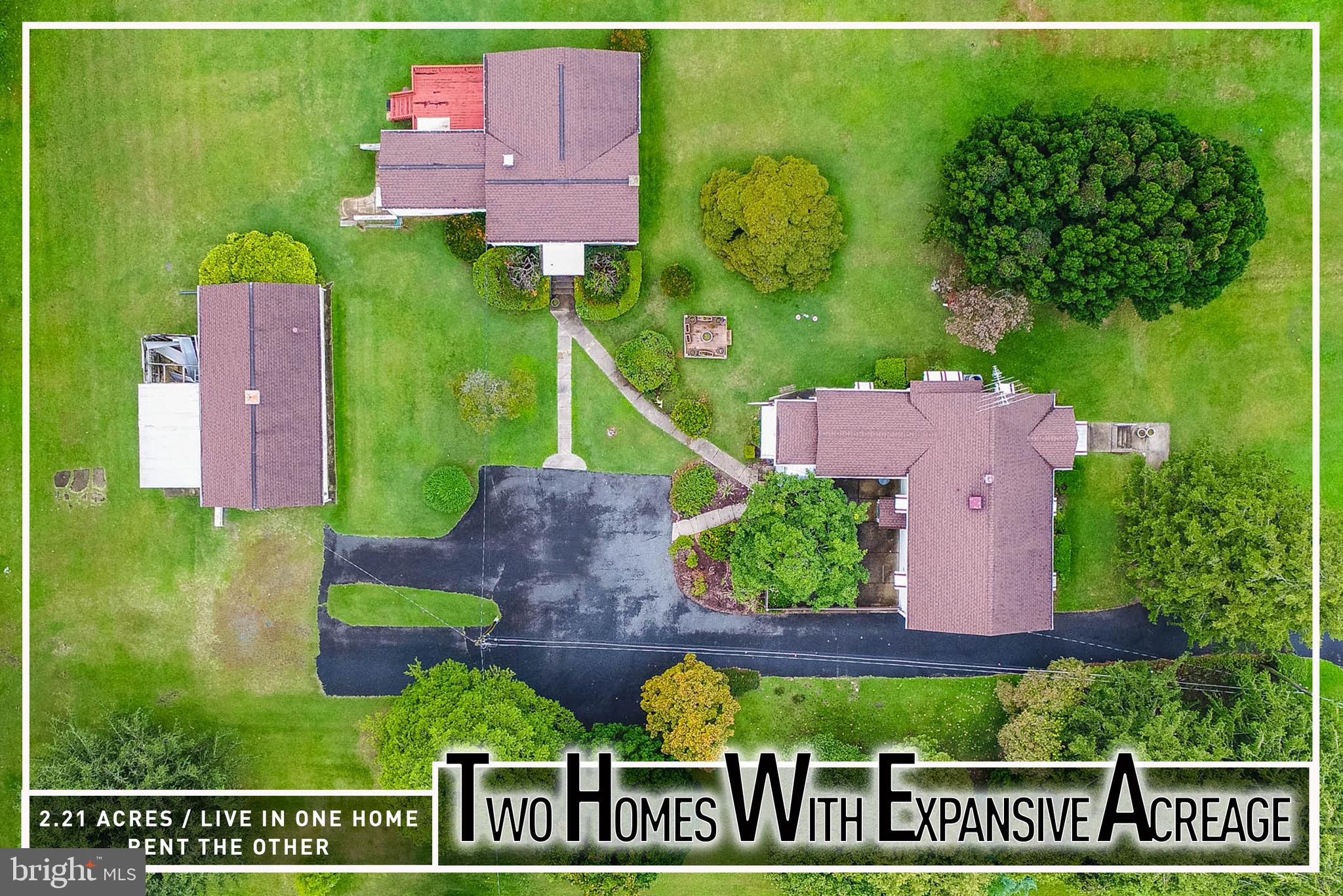 Unique multi-home property on over 2 acres! Rare opportunity to own an expansive parcel featuring two separate houses across three tax IDs. The main house offers a spacious living room, kitchen, 3 bedrooms, 2 full baths including one in the finished lower level with a family room, plus an enclosed porch and rear patio for outdoor living. The second home provides its own private space with a living room, kitchen, 2 bedrooms, 1 full bath, and a rear deck. Additional highlights include a detached garage, abundant parking, and sprawling grounds with endless possibilities. Conveniently located close to shopping, dining, and major roadways. An ideal setup to live in one home and rent the other for added income! Sold As-Is - Buyer to Verify Zoning