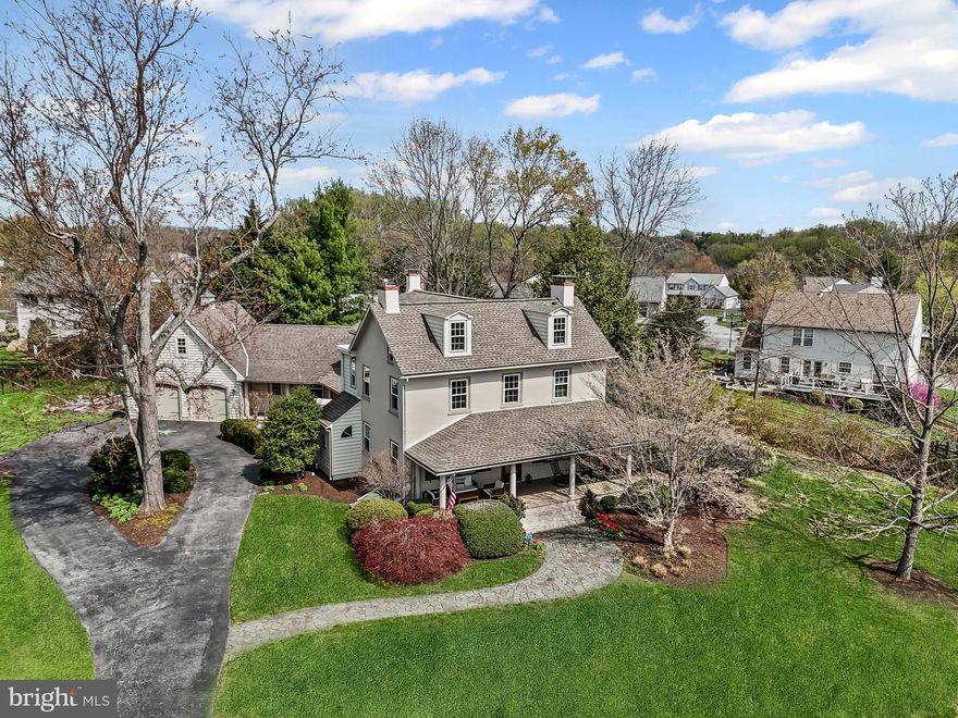 A rare opportunity to have the best of two worlds! Welcome to 148 Bromley Dr, known as the J. McCormick Farmhouse. Live in a historic 1800’s farmhouse that has been renovated through the years to meet today’s standards while enjoying the benefits of neighborhood living in the established community of Breckenridge. Situated in the rear of the community, on a lovely 2/3 acre lot  and at the end of the cul-de-sac. The original structure was built around 1810 by the Pierce family then sold about 10 years later to John Mitchell. Mr. Mitchell was one of the first property “flippers”. He is known for purchasing homes in the Mill Creek area, improving them, then selling for a profit or leasing to tenants. In this case, the property was kept in the Mitchell family for over 120 years. The farmhouse was saved from demolishment and restored in the early 1990’s. Preservation of the original features of the home was paramount and you can still find the molded mantels of three fireplaces, splayed and paneled window reveals, numerous built-ins, and molded four panel doors. Curb appeal can’t be beat with a wide and sprawling front porch welcoming you into the stuccoed, masonry two story home. Additions to the home in 1830 (back wing) and 2000 (rear porch, garage and shop) enhanced the livability of the home as time passed. The main floor is host to a comfortable living room with adjacent parlor or family room, large dining room perfect for everyday use or formal occasions, a well equipped eat-in kitchen, mudroom and powder room. Upstairs you will find a primary owners suite with fireplace, built-in window seats, walk-in closet, and full bathroom with oversized shower featured two rain heads. Second floor is complete with two additional bedrooms and full hall bath with jetted tub. Finished attic space is flexible space that works well as a bedroom, office or craft room. Huge storage area for closet space or seasonal needs. Workshop adjacent to the two car garage with electric, heat/air and water. Above the garage is unfinished loft space that can be easily finished for additional living area. The property features beautiful gardens that give color and interest all season long with an emphasis on native plants. Also installed in 2024, you'll find raised bed gardens with drip irrigation.  Imagine a perfect ending to a summer’s day of sitting on your front porch swing watching the fireflies dance in the gardens while winding down after at day at nearby Westminster community pool. Additional improvements include new roof, carpet and garage doors (2020), repainted exterior (2025), all new windows throughout (2023),built in bookcases (2022),new water heater (2019), west facing roof new in 2014, 2 air conditioning units installed (2011), new mini split in the workshop (2024), and updates to kitchen including new refrigerator (2022),microwave (2020), dishwasher (2015),oven (2015) as well as new washer/dryer (2022).