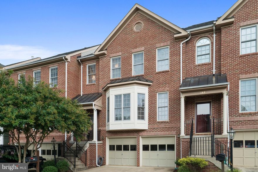 Spacious, Sun filled & Sparkling clean! Gourmet kitchen w/ Corian counters & stainless appliances. Separate formal dining room. Lovely deck off kitchen. Open family room w/ gas fireplace. Main level & upstairs have hardwood floors. Finished walkout basement w/ ceramic tile that leads to shaded patio overlooking extensive hardscape & gorgeous flower beds w/ fenced backyard. Shows like a model!!