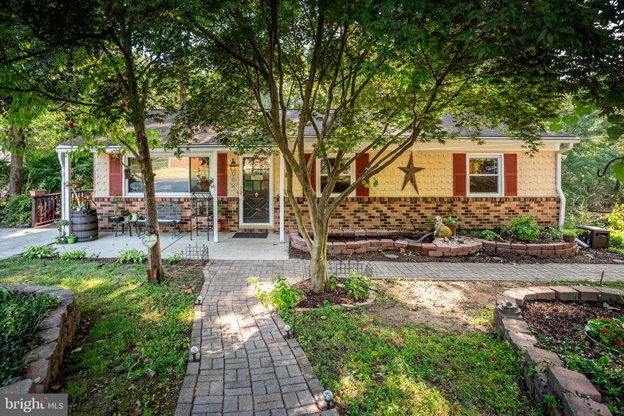 Price Firm! 2,288 Total Finished Square Feet in this Easy Living Renovated Rancher just for you! .68 Acres for Nature Lovers, too!  Hardwood floors Throughout Main Level. Open Kitchen has Granite Counters, Black Appliance Package & Built-in Microwave. Pantry.  Wood Fireplace, Large, Long Picture Window warms up Living Room; Renovated Bath with Sit-Down Shower, Double Vanities, Tub & Laundry Chute! Guest Powder Room. Owner Bedroom boasts Walk-In Closet. Fully Finished Walkout Basement offers Many Possibilities:  In-Law Apt, Office, Studio, Gaming Room. Basement Features include: Vinyl Flooring, Family Room with Wood Stove, Bedroom and Full bath.  Second Spacious Room with Closet served as a 5th Bedroom, then Art Studio.  Brand New Sliding Door leads to Private, Brick, Side Patio, Flower Beds, Fire Pit & Extra Parcel included with this Home. Rear Screened-Porch has open area for Grilling and Wrap around Deck which Overlooks Mature Shade Trees & Creek. Concrete Patio, Stone Koi Pond, & Brick Walkway with Arch Adorns the Front of the Home.  Double-Glazed, Energy Efficient Windows, Architectural Roof and Electric Water Heater were installed in 2011. Well Pump & Appliances just a few years old. Septic System is Private and not shared by community. Whole Home Generator - 1 yr new. Updated Concrete Driveway can hold up to 4 vehicles. The Park is located across the Street! Close to Veterans Highway, BWI Airport & Major Routes to downtown Baltimore and DC!