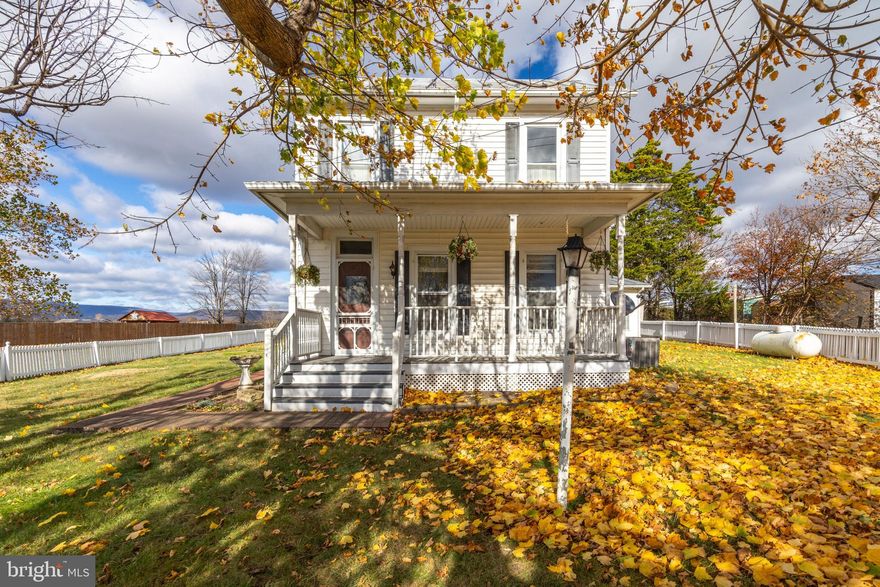 Welcome to this charming farmhouse-style home in Woodstock, VA, perfectly placed on a little over an acre with the convenience of town amenities just minutes away. From the moment you pull up, the detached three-bay garage and expansive yard offer all the space you need for vehicles, hobbies, or outdoor enjoyment.

Step inside through the laundry/mudroom area that opens into a spacious kitchen filled with cabinet space and sweet views through the window. The flow continues into the great room — currently used as the primary bedroom — featuring large windows that allow natural light to pour in, along with a full closet. Durable Laminate and LVP flooring extends throughout the main level, adding both style and practicality.

A formal dining room connects to the kitchen and living room, creating an ideal layout for gatherings, and a full bath on the main level offers convenience for daily living.

Upstairs, you’ll find three bedrooms and another full bathroom, ready for your finishing touches and personal style.

Outside, enjoy the best of country living: •