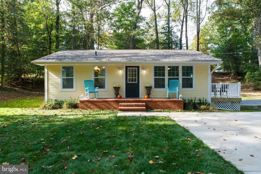 MOVE-IN READY CHARMING RANCHER. Numerous renovations and updates include kitchen cabinets, counters, appliances; bath; main level wood floors and carpet in the finished basement; windows and doors; roof, siding, driveway. Enjoy outdoor living from the spacious front porch and back deck overlooking the large private lot, located on a dead-end street. Just minutes to downtown, Rte. 50, and shopping.