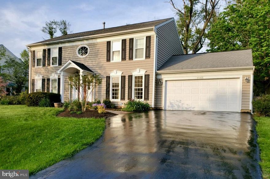 Welcome Home to this exquisite 7-bedroom/3.5 bath Colonial situated on a quiet picturesque 1/3-acre level lot. Lushly landscaped and adorned with a flagstone walkway, fully fenced rear yard, flagstone patio and private backyard with vista veiws. Spacious 2-car garage with expansive driveway for additional parking.  Lovingly maintained and abundantly updated! The formal living room and dining room on the main level are inviting to your most festive gatherings.  You will love the newly installed beautiful luxury plank vinyl floors on the main level and the neutral carpeting throughout. The bright and sunny kitchen is equipped with granite counters, white cabinets, stainless steel appliances, recessed lights and skylight. Relax and unwind in the welcoming family room featuring a bay window and decorative wood-burning fireplace. The upper level owners retreat is ensuite and features a private sitting room and a luxurious remodeled bath showcasing an oversized free-standing tub, separate shower, marble vanities, custom tile and designer lighted mirrors. 3 additional bedrooms and a full bath complete the upper level. The newly finished and private lower level can be used as a 2nd home and is perfect for in-laws, au pairs and other guests. Impeccably finished with acessibilty from the main level or a private exterior rear entrance, both leading to the lower level family room. Conveniently equipped lower level kitchen features designer cabinets, quartz counters, undermount sink, breakfast bar, custom glass backsplash and stainless steel appliances including a full refrigerator, electric range, built-in microwave, dishwasher and garbage disposal. 3 additonal bedrooms, private laundry with stackable W/D, storage and a stunningly finished hall bath complete the lower level. Updates include: Newly finished basement, remodeled  owners bathroom, new LPV floors, new carpeting, new dishwasher, new refrigerator and new 80 gallon gas water heater. Just minutes to parks, grocery stores, shops, restaurants, Olney Theater, spas, gyms, swim center, & walking and biking trails. A commuter's dream that's close to the ICC, I270, I495 & Shady Grove/Glenmont Metro Stations!