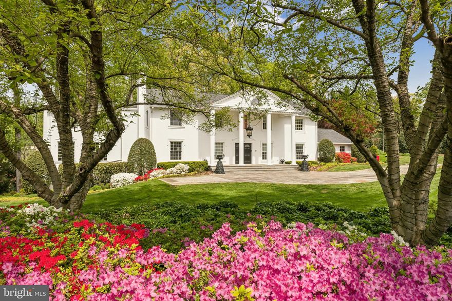 Welcome to 932 Woburn Ct, a timeless all-brick estate nestled on nearly an acre of professionally landscaped grounds in one of the area’s most desirable and convenient locations. Just 10.4 miles from the D.C. line and within 20 minutes of both Dulles and National airports—and 45 minutes from BWI—this property offers unmatched access to the city while maintaining the serenity of a private retreat.

A gated entrance welcomes you home to a stately stone driveway made from real stone using green construction methods, thoughtfully designed to drain all rainfall through to the soil. Elegant stone walkways wind throughout the grounds, complementing the privacy-focused landscaping that was designed for both beauty and function. Mature trees have been purposefully placed and pruned to maximize sunlight while maintaining a sense of seclusion, allowing you to enjoy the garden and outdoor living areas in total comfort.

Inside, the heart of the home is the expansive kitchen, featuring raised ceilings and dramatic floor-to-ceiling windows that frame picturesque views of the backyard. Outfitted with high-end appliances, custom cabinetry, and generous workspace, this kitchen is ideal for both everyday living and entertaining.

Luxurious heated tile and marble flooring span the home, enhancing the elevated finishes and thoughtful craftsmanship found at every turn. A private three-story elevator provides seamless access to all levels, where you'll find spacious walk-in closets and five gas fireplaces—each offering warmth and ambiance at the push of a button.

The sun-parlor or great room is a standout feature—bathed in direct sunlight from sunrise to sunset, thanks to intentional landscaping and orientation. Adjacent to this space, a fully retractable and hidden wall enables sound control when hosting large groups or children’s parties, creating versatility for how the home can be enjoyed.

All windows and doors are security-level, providing enhanced peace of mind without compromising the home’s elegant style. And for additional reliability, the home is equipped with a Generac whole-house generator for uninterrupted comfort.

The walk-out lower level is equally impressive, featuring a full bar and easy access to the backyard, where you’ll find your own private resort-style oasis. The heated saltwater pool includes a retractable cover and a waterfall feature, offering both beauty and functionality. The expansive stone pool deck provides multiple zones for relaxing and entertaining—including a covered wet bar and a luxurious outdoor bathroom with a frameless glass shower that brings spa-like elegance to your own backyard.

With ample space to host both intimate gatherings and large events, 932 Woburn Ct offers the perfect blend of sophistication, functionality, and resort-style living.

Perfectly located just minutes from D.C., major commuter routes, and three regional airports, this sun-kissed estate combines convenience and privacy like no other.