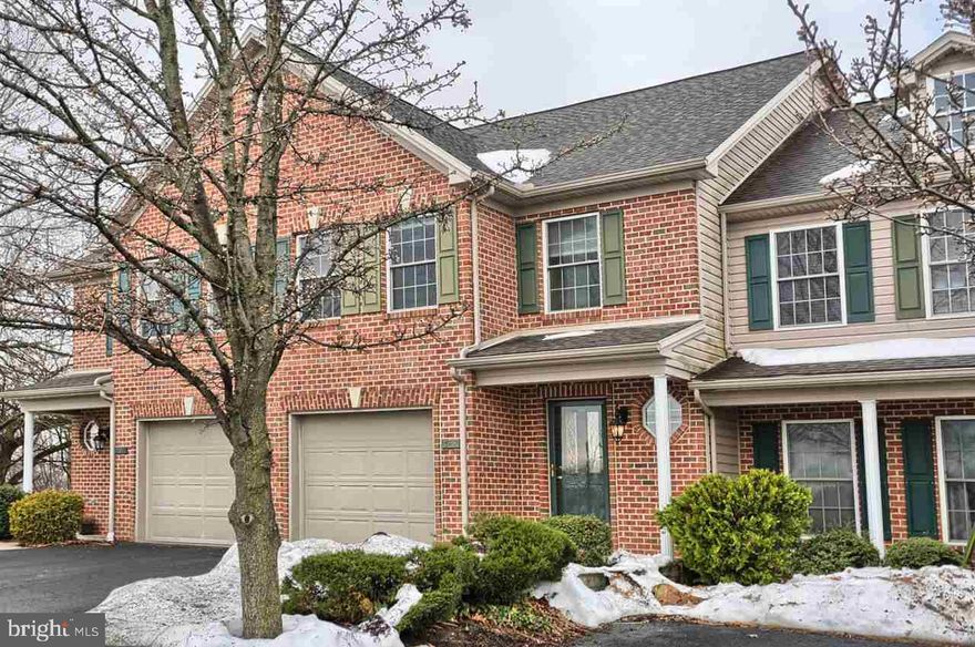 Delightful townhome in a great location! From the inviting foyer with wood floor, half bath and open staircase, to the large kitchen featuring a dining area, that opens to the living room and dining room, this home has something for everyone!  2 bedrooms each with a private bathroom (1-shower has 2 heads) and walk-in closet, 2nd floor laundry area with washer/dryer; a full basement and a 1-car garage.  Enjoy relaxing on the rear deck overlooking the common area and the cul-de-sac location.   HOA fees $75/mo