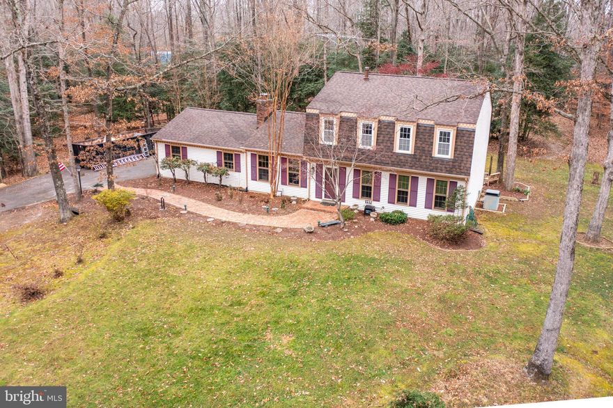 Great Dutch Colonial tucked away on 3 acres, private & peaceful. New roof installed on home & shed in November 2021. Home features 4 upper level bedrooms, 2 full baths, main level offers family room with cozy wood burning fireplace & tasteful brown painted beams, spacious living room, dining room, eat in kitchen & 2 car garage. Home has great bones, looking for the right buyer to put their personal touches on cosmetic items. Enjoy all the beauty & backyard oasis off the back deck. New windows being delivered 12/28/21, should be installed by settlement. NO HOA!