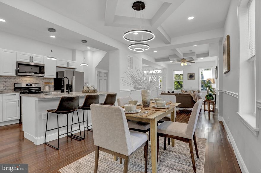 3 levels of Luxury best describe this modern porch-front home with an open floor plan that boasts 4 bedrooms (including a master suite), 3.5 bathrooms & over 2800 square feet of finished living space. The gourmet Kitchen features lots of storage, granite countertops w/ custom backsplash, & stainless steel appliances with an over-the-range microwave. Bathrooms w/ masterful tile work, New vanities, and modern fixtures. The finished basement & fenced-in yard is great for entertaining. New Plumbing, HVAC & Electric permitted & inspected. Beautiful floors, Trey Ceilings, Recess lights & custom staircase. This home is centrally located about a mile away from a major shopping mall with restaurants like TGI Fridays, approximately 2 miles from Forest park golf course & less than 5 miles away from the Baltimore Ravens & Orioles Stadiums.  The home is also within walking distance (Less than 2 miles away) from the 745-acre Druid Hill Park which features The Baltimore zoo & the following Amenities: Playgrounds, Tennis Courts, Ball fields, Athletic fields, Disc golf course, Pool, Basketball Courts, Greenhouses, Picnic groves/pavilions, Howard Peter Rawlings Conservatory and Botanic Gardens, Zen garden, Urban greenway park, Jones Falls Trail, City Farms Garden, Safety City, Lakeside Loop Trail around Druid Reservoir. Luxury Living at Affordable Pricing!!! Could be eligible for $8750 BorrowSmart Program & other grants programs