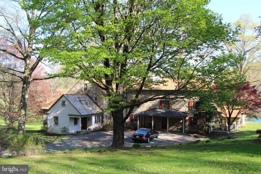 Little Valley Farm enjoys the best of understated historic charm with a substantial John Milner designed addition, allowing for a sense of history while enjoying all the benefits of current construction sizes and materials for today’s lifestyles.  Surrounded by rolling hills, two ponds and two streams, the 22 acre property with park like vistas cannot be beat for the discerning buyer looking for true serenity in a Radnor Hunt location; but also with quick access to Main Line private schools, abundant shopping and the Paoli train station with direct access to Philadelphia, New York and Washington,  The property includes a beautiful Chester County bank barn, an oversized pool and spa, and a 3-4 bedroom guest/caretaker house. The main house with 5 bedrooms, 4 full and 2 half baths, offers scenic views from every room. A well equipped kitchen and pantry open to a large, sunlit eating porch and office with 3 built in desks and shelving, especially appropriate for 2021 living. The kitchen overlooks the family room with fireplace, built in cabinetry and double glass French doors leading to a covered porch offering expansive views of the grounds. The gorgeous sun room, pool and spa were added by the current owners. The sun room, with double French doors; includes a bar, seating area, built in cabinetry, book shelves; and a long indoor planter providing cutting flowers all year long. Rounding out the main floor are a formal living room, dining room, powder room, and both mud room and formal entrances. Other highlights of the house include a finished lower level with double French doors leading to a large Flagstone patio. The oversized en-suite master bedroom offers a wall of windows, a deck overlooking the valley for morning coffee; a dressing area with 2 walk in closets, and 2 built in dressers.  A recently replaced main house cedar roof, and approved design and permit for a new septic system are just two of the many continuing improvements made by the current owners.  A must see, Little Valley offers a beautifully renovated expansive home, unsurpassed views, serenity and easy access.