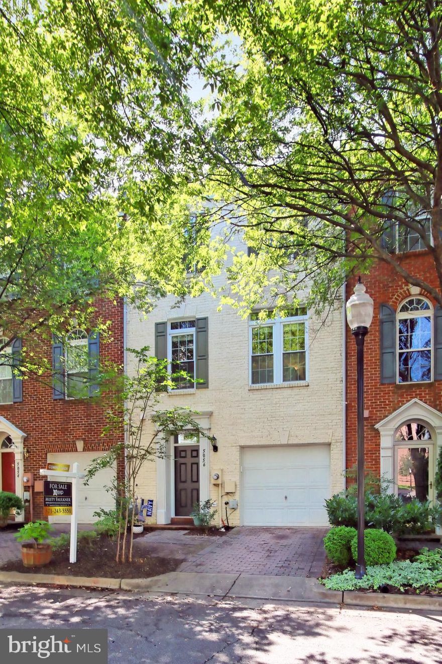 Beautiful Franklin model in the perfect location! Entry level recreation room with gas fireplace and a private patio backing to parkland and the walking path.  Main level features gorgeous hardwood floors, high ceilings,  a fantastic open floor plan and an open kitchen with room for table and chairs. Living room and family room are located off kitchen. Private deck off kitchen backs to parkland and the walking path. Tons of natural light throughout! The upstairs features gorgeous hardwood floors, the primary's bedroom with en-suite bath, two additional bedrooms and another full bathroom.  Attached one car garage with additional storage and one parking space in driveway. Visitor parking VERY close by. Home faces the pocket park. Updates include: New windows and new front and sliding back doors in 2020, new roof in 2018, new dryer in 2018, new washing machine in 2017, new garage door opener in 2017, new outdoor AC condenser unit in 2016 and new stainless steel kitchen appliances in 2016. The home also features a Nest Protect system with security cameras in the front and rear exteriors of the property. Amenities include shuttle to the metro, pool, and gym. This home is a must see!