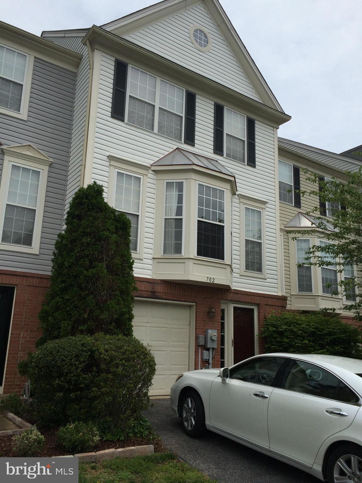 Lovely 3 bedroom , 2 full bath , 2 half bath garage townhome in sought after Windgate community. Hardwood Flooring in Living room, dining room and kitchen. Unit is neutrally painted throughout. Gas fireplace in 1st level family room with a fireplace and LTV flooring that opens to a patio and fenced yard. Main level dining room with Pella doors opens to a lovely deck. Great location. Parking spaces are numbered but not assigned. Non smokers. Pets case by case,