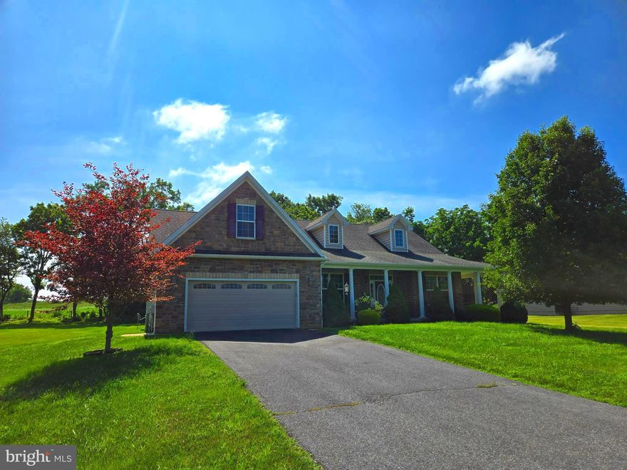 Once upon a time, there lived a lovely home on a large, nearly 2/3 acre lot, in a picturesque and desirable neighborhood, in a beautiful country setting. All the other houses in the neighborhood were jealous, as this home had 3 of its 4 bedrooms on the main floor, a massive stone fireplace, a gigantic wraparound front porch, and magazine-worthy perennial landscaping. Located immediately adjacent to open farmland behind it, over which the sun rises, this home was only one of a handful of homes in the neighborhood that could make that claim. But the exterior beauty of that home didn't stop there--the private and spacious backyard also boasted of a dense tree line along the rear line, a hot tub (which conveys with the sale), and a screened-in porch overlooking all of it.  But this home wasn't just beautiful on the outside. It was beautiful on the inside as well. With kitchen appliances dressed in stainless steel, counters adorned with granite, and the aforementioned stone fireplace, the heart of this home was warm and inviting. With hardwood flooring throughout much of the main level, a flowing layout, a convenient split-bedroom floor plan, and 9-foot ceilings on the main floor, this home was a people-pleaser with big personality. Further complementing this home's character was its secret escape--the 4th bedroom upstairs. Evoking more envious thoughts from the other homes was the fact that this home wasn't even fully-grown yet! It still had another nearly-2,000 square feet of potential in the huge basement! With a rough-in for yet another full bathroom, tons of space, and a double-door walkup to the rear yard, this home could be whatever it wanted when it grows up. Despite its young age, with great location features, such as being close to Interstate 81, close to the hospital, shopping, and dining, and feeding several of the Hedgesville schools, the home had already positioned itself for success in life. Though one may think this all sounds to good to be true, rest assured that this is no fantasy. The only missing thing to complete this fairytale is you! Make this home a main character in your "happily ever after"! IF YOU LIKE WHAT YOU SEE, CALL !!!!!