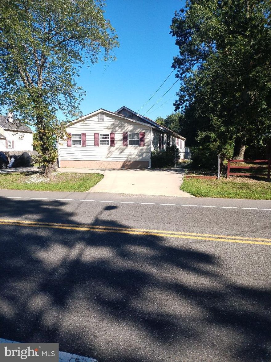 Detached 3Brs, 2Ba, Huge Family Room and Over Sized Master Bedroom W/Tub, Sunroom, Hard wood Floors under Carpet, Large Lot for your Farming at the second fenced Rear Lot Which Is Part Of The Property.