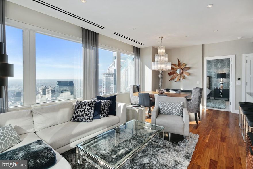 Live in this gorgeous corner unit where Luxury living has reached new heights in Philadelphia at The Residences at Two Liberty. Five-star amenities and concierge services are yours the minute you arrive. Enter the private resident's lobby with door staff and concierge, at your service 24/7. Elevators with fobbed access provide entrance to your residence as well as the 38th floor amenity level. North and East facing apartment with Spectacular River, City and Sunset unobstructed views in this luxurious corner unit floor plan including 2 Bedrooms  and 2  baths. The apartment features a contemporary plan with hardwood floors, walls of windows throughout, and an open living room, dining room and kitchen which offers spectacular views of the city. The finishes are of the highest grades including a gourmet kitchen with granite countertops, Snaidero cabinetry and built-in stainless Miele appliances and a Sub-zero refrigerator. Master bedroom suite includes a luxurious marble bath w/ glass enclosed shower and separate tub, dual vanities, and a generous walk-in closet w/ built-in organization. Second bedroom has en- suite bath and additional walk in closet.  The laundry room has further storage and high efficiency stacked laundry, and a large powder room. With the finest amenities, there is access to a 24hr fitness center/spa with endless pool, steam showers, sauna, yoga studio and massage rooms. There is a business center with board room, media and billiard room, a chauffeured Mercedes town car and room service available from Daniel Stern's outstanding R2L restaurant, with direct resident access. For your convenience, valet parking is available at an additional fee. Liberty Two is in the heart of Center City and surrounded by the best shops and restaurants with access to Rittenhouse Square, Dilworth Park, and the Benjamin Franklin Parkway with world class museums. Unit has 7 yrs left on partial tax abatement
