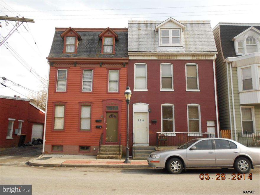 Solid brick 5 bedroom, 2 bath townhouse in excellent condition.  New rubber roof, new gas furnace, hot water heater, and some new windows.