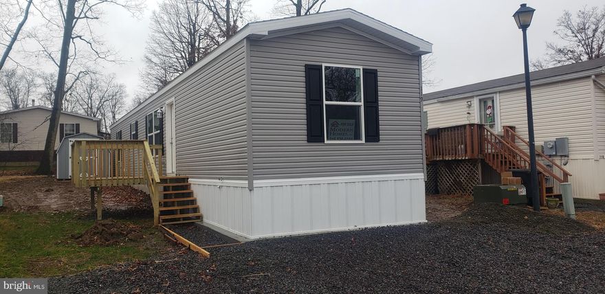 Have you been wanting to down size? New home in the desirable Richland Meadows community. 119 Ridge Drive is a 2 bedroom, 2 bathroom 880 sq ft home.  The home has central air, off street parking enough for two vehicles, 8'x8' shed, 8'x8' deck, refrigerator, stove, built-in microwave, and dishwasher. Why pay high rental prices if you could own a manufactured home for the same costs or lower? Low lot rent of $600.00 includes water, sewer, trash, recycling, common area maintenance, and community roads. Community requires owners to have a background check, application is $60, and have a minimum 640 credit score and no criminal history. Restrictions on dog breeds and size, one pet per home. Loans are available for those with good credit and you must put a minimum 5-10% down depending on credit score.