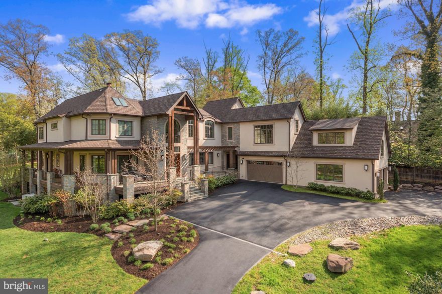 Sublime luxury living is in store for you in this elegant contemporary home located near Potomac Village.  The gated entry and circular driveway provide an approach to the impressive stucco , stone and beam home and its private 1.35-acre grounds. Built in 2014 and looking new, the home offers a resort environment with 11,500 square feet of serene, light-filled space and countless luxury features, wonderful indoor/outdoor entertaining, quiet enjoyment of nature, multi-generational living and professional at-home work with multiple work spaces.  The Foyer reveals the home's open flow, large interior spaces, lovely spiral staircase and sparkling Living Room. At the heart of the home, the Great Room with soaring two-story ceiling offers a large sitting area focused on the stone fireplace, a butlers bar, and opens to the covered patio and breathtaking Gourmet Kitchen. The wonderfully sleek Kitchen offers dual center islands, highest quality stainless appliances, three sinks, two dishwashers, and walk-in pantry. The adjoining Breakfast Room provides views of the extensive outdoor entertaining space and grounds.  There is a lovely Dining Room, Office and additional Sitting Room or Den, all with the home's signature large windows. A spacious Owner's Bedroom Suite with gorgeous Full Bath sits on the Main Level. A large Mudroom with Laundry and built-ins provides access to the garages. An Elevator is among the features making this a handi-cap accessible home. Upstairs, via the main or second staircase, the Second Owner's Suite offers luxurious space including a sitting area and two balconies offering views of the lawn and trees, as well as two large walk-in closets and a sumptuous Full Bath. The Upper Level provides an open overlook to the Great Room below, as well as a large Family Room or Entertainment area. This level offers three additional Bedrooms, each with its own Bath. Two of the Bedrooms share an entertainment loft above. A large professional Office on the Upper Level sits above the garage, and has its own separate outside entry and Bathroom. The daylight fully finished Lower Level offers walk-up stairs to the lawn, a large Recreation Room, Media Room, Full Bar, Spa Room with sauna, Gym and additional space.  Wonderful exterior finished space includes a stone fireplace with waterfall feature, hot tub, built-in grill and covered bar and entertainment area. Two garages are configured to provide 4 spaces, with a 22-foot ceiling and basketball hoop and electric car charger.    A pool can be easily added in two possible locations and renderings are available.  Features include geo-thermal HVAC with 5 zones, insulated concrete form construction, Energy Star rating, Smart Home controls, zoned sound system, gorgeous hardwood flooring, skylights, radiant floors, oversized triple pane windows. Monthly heating and cooling costs average less than $450 including Tesla charging. Geothermal and air circulation systems continuously pump in fresh air and remove stale air and pollen - a gift in the Covid environment. The custom property was thoughtfully constructed to the highest standards and provides an unusual opportunity for today's buyer.