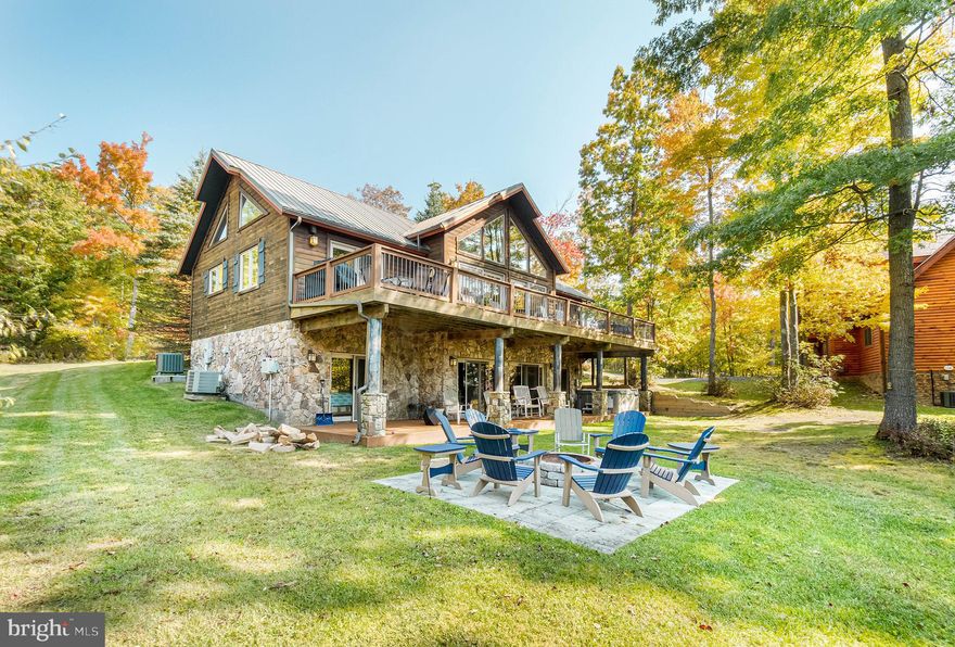 Beautiful log-sided home in the prestigious community of Deep Creek Highlands. This well-appointed mountaintop retreat offers 5 bedrooms (2 of which are en suites), an open floor plan, two gas fireplaces, hardwood floors, cathedral ceilings and a large kitchen. One mile to Wisp Ski Resort & Whitewater Course. Enjoy the mountain views with family and friends from the deck or hot tub. Community amenities include: outdoor pool, tennis, playground, walking trails, and class 3 lake access. Established rental "Glass Mountain Lodge".