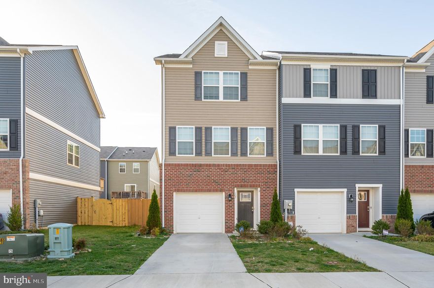 Move in ready 3 level end unit townhome in desirable commuter location. 3 bedrooms, 2.5 bathrooms with 1 car garage. Features fenced yard and deck. Lower level recreation room, luxury plank vinyl throughout the lower/main levels. Must see to appreciate,
