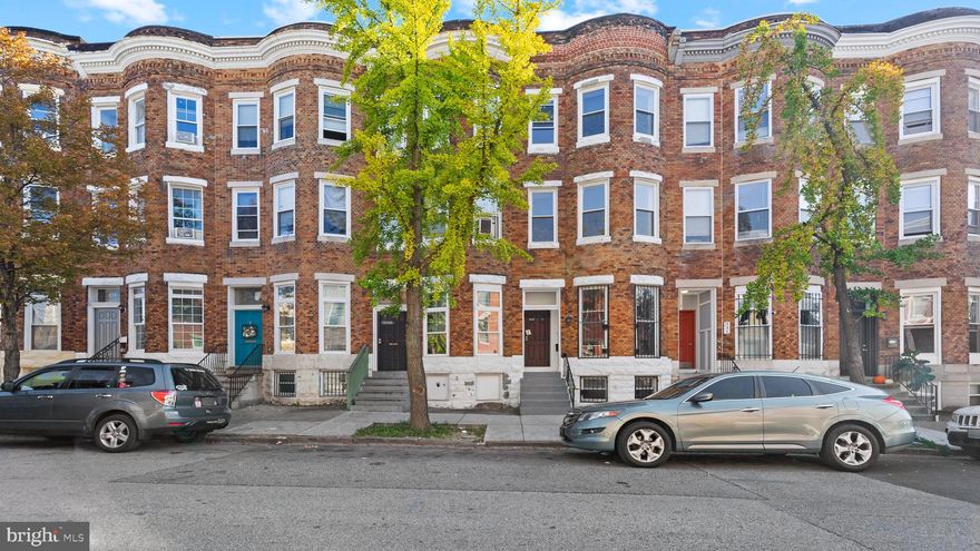 Welcome to 333 E. 22nd Street, a fully renovated 5 bedroom, 2.5 bath townhome.  **Ask listing agent for buyer and first time home buyer incentives offered by the seller. The seller is also offering Rent -To -Own options and buyer assistance; please contact listing agent for details.**Inside , you will find beautiful brand new hard wood floors on the 2nd floor, with refinished floors on the 1st and 3rd floors and stairs.  The kitchen has recently been updated with some new and some resurfaced cabinets and stainless steel appliances.  The home has 3,200 square feet of living space which is why all five bedrooms are very large in size.  Other updates include brand new epoxy flooring in the basement and a freshly painted outdoor patio space.  Enter through the front door into the living room and gaze through the open floor plan back to the kitchen.  Dining area is in between.  The 10 foot ceiling height with open floor plan layout and large front room windows gives the first level a bright open and airy feel.  The main level also has a dining area and a half bathroom for convenience.  The rear door off the kitchen leads to a fenced-in patio space followed by a two car parking pad.  The second level has three large spacious bedrooms with one full bathroom that is accessed from the hall. Up the grand staircase to the third level you’ll find two very large spacious bedrooms with one more full bathroom that can be accessed from the hall.  All of the levels in this home have a very high ceiling height with large windows bringing in tons of natural light.  Gas heat, central air conditioning provide for year round, cost effective comfort.  The basement level is gigantic and could be used for an at home gym, office, and space for storage.  Towards the rear of the basement, you will find the laundry room.  Don’t miss this opportunity to own a spacious home with tons of square footage and five very large bedrooms.