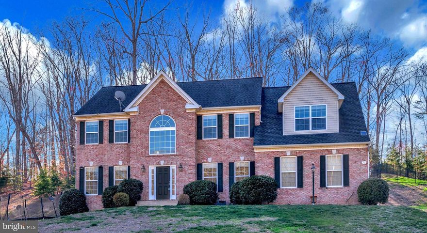 This Beautiful Brick Colonial is positioned on  just over 3 acres of land in Stafford County.  It is conveniently located close to interstate 95 and the Virginia Railway Express.  If you enjoy nature you will love living so close to Crows Nest Nature Preserve and Aquia Landing Beach.  This spacious home features   3448 Sq Ft.  of living space on the first two levels plus a finished basemen . Stepping into  this  home  the two story foyer with hard wood floors welcomes you with an abundance of natural light.  You will find the house has been freshly painted giving you a fresh clean palate.  The dedicated office is situated in the front of the home making it the perfect spot to work and look out over the neighborhood. The primary suite offers a  sitting room, a large walk- in closet and  two additional closets.   Additional features  on this level include 3 more Bedrooms a Jack & Jill With a 5th Bedroom on the lower level and a full bath on the lower level.   This  2-story Colonial home, offers timeless elegance and modern comfort. Featuring a spacious kitchen with ample cabinetry and counter space, this home is perfect for entertaining and everyday living. The inviting family room is ideal for gatherings, while the formal dining room and living room provide classic charm for special occasions. With a well-designed layout, this home is a must-see. Schedule your showing today!