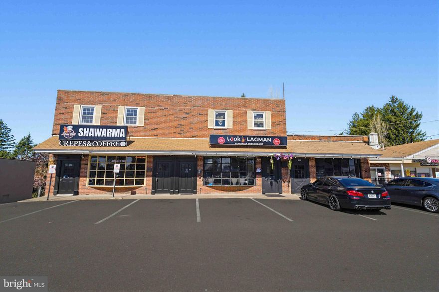 Fully leased mixed-use investment opportunity on a high-traffic, high-visibility corridor with strong street presence and prominent storefront exposure. This income-producing property consists of three ground-floor commercial spaces with full basements, ample surface parking and two second-floor residential apartments, each offering 2 bedrooms and 1 bath. The effective annual gross rent of $156,885 provides a NOI of approximately $115,000, creating strong in-place cash flow for an investor seeking a stabilized asset with diversified income streams.