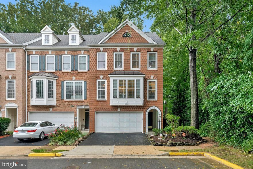 Classically designed End Unit Townhome in sought after Fair Chase.   With mature trees & professional landscaping.  Custom deck with lighting and slate patio backs to woods.  Open & bright floor plan features highly crafted details & upgrades galore!  Exquisite moldings, gleaming HDWD floors all 3 levels, with upper floor and lower floor HDWD installed more recently.  Gourmet granite Kitchen with 42" raised cabinets.  Tile back-splash & a huge kitchen island.  Stainless Steel appliances - NEW ovens NEW Cooktop.  Refrigerator, Microwave, Washer/Dryer 2018.   HVAC system installed just 5 years ago.    Luxury Master Suite with a soaking tub and a shower.  Backs to treed common area, with lots of great walk trails.  Close to Fair Oaks Mall,  Fairfax Corner, a Wegmans, I 66 and Fairfax County Pkwy, restaurants and movie theatres, all so close by.   You'll love your life here!