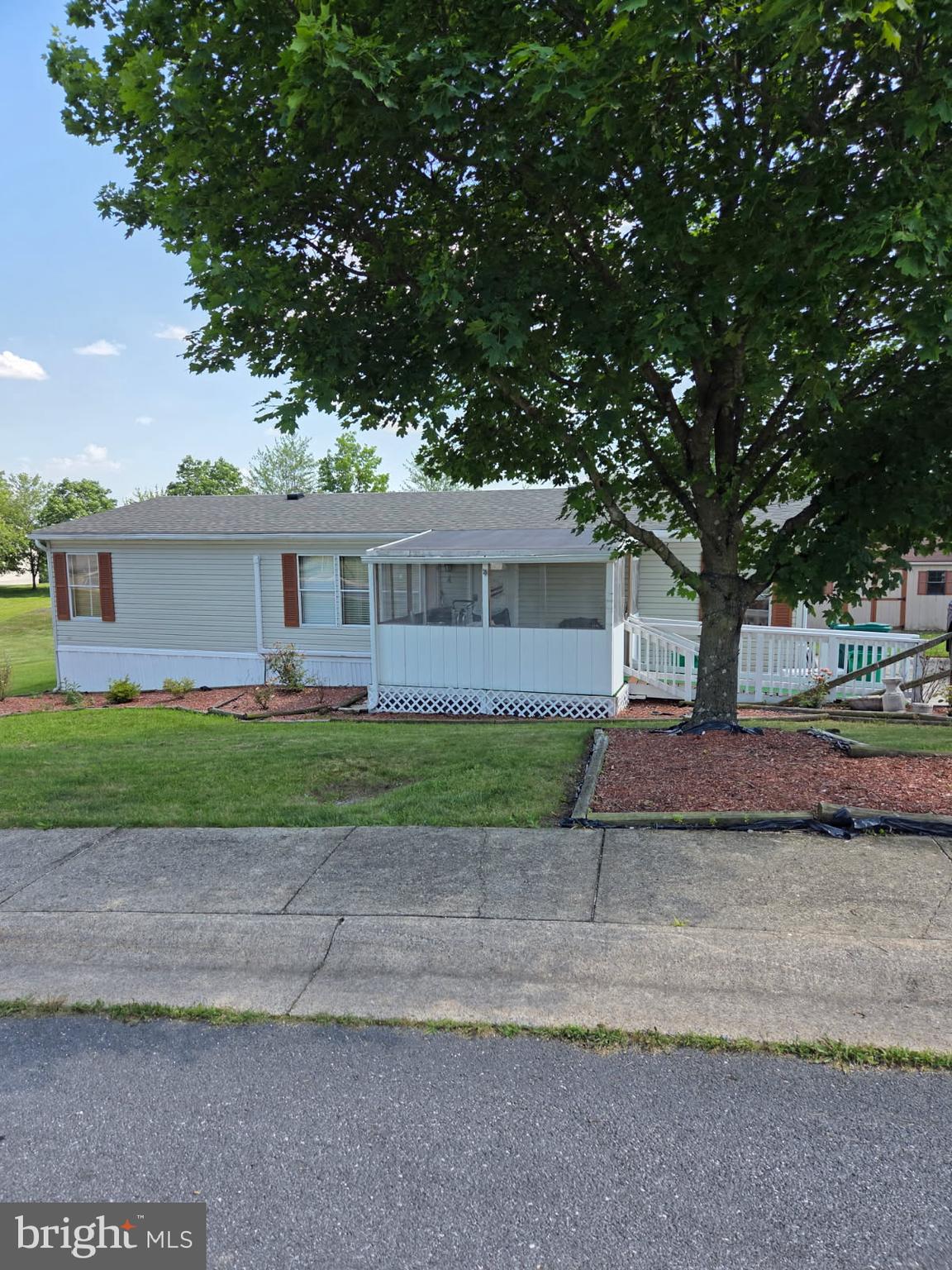 PRICE REDUCED ,VERY WELL KEPT HOME WITH NICE FINISHING TOUCHES WITH WOOD IN KITCHEN AND ON DOORS. HOME IS THREE BEDROOM WITH FULL BATHROOM AND WALKIN CLOSET IN PRIMARY BEDROOM. BOTH OTHER BEDROOMS HAVE DOUBLE CLOSETS. THERE IS A SUN PORCH WHICH COULD BE A BEDROOM OR OFFICE AS WELL IN THE REAR, 2 FULL BATHROOMS, WITH A LARGE KITCHEN AREA AND A FRONT COVERED PORCH AND A REAR DECK. ROOF WAS REPLACED IN 2022 AND THERE ARE 2 HEATING SYSTEMS AND CENTRAL AIR AS WELL. LARGE SHED IN REAR YARD. DOUBLEWIDE IN A VERY NICE PARK MUST BE APPROVED BY PARK OWNERS.