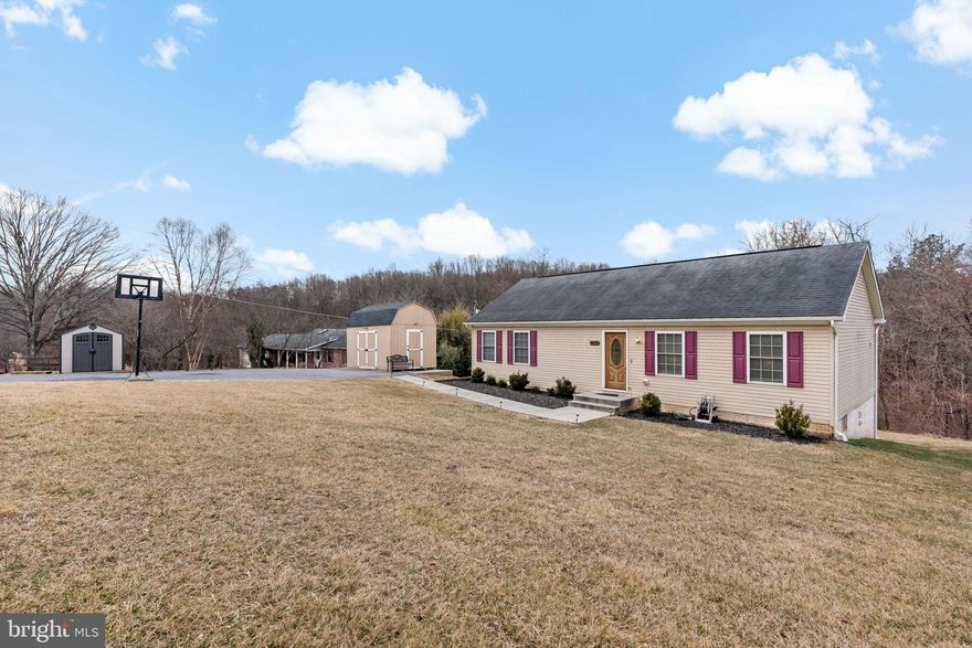 A stunning home that offers the perfect balance of modern comfort and peaceful living. Nestled on 2.01 acres, this property provides ample space to enjoy the beauty of nature while still being conveniently located near major amenities. No city taxes, no HOA and USDA approved!

With 3 bedrooms, 2 baths, and 2,484 sq. ft. of living space, this home has been thoughtfully updated. The kitchen features gorgeous granite countertops and flooring, both updated in 2020, adding a timeless and elegant touch.

The water heater was replaced in 2021, ensuring efficiency and reliability. Additionally, the home boasts a high-end Culligan water softener, whole-house filtration system, IronClear iron filter, UV light, and reverse osmosis filter—a total of $10,000 worth which were installed in December 2024, offering top-tier water quality and peace of mind.

The finished basement, completed in 2020, includes a spacious bedroom, a cozy reading nook, and a full bath. A walkout exit adds to the convenience, and a basement fire sprinkler system (installed in 2011) provides additional safety.

The master bedroom features a large walk-in closet with built-ins, offering plenty of organized storage.

Outside, you’ll love the gazebo and shed, both included with the property, making it a great space for relaxation or entertaining. The driveway has enough parking for at least eight vehicles, with plenty of space to build a large garage.

This home is located in a top-rated school district,  serving Oakdale Elementary, Oakdale Middle, and Oakdale High School, all known for their excellent academic programs.

Situated just three minutes from Route 70, this property has a tranquil surroundings yet it is close to shopping, dining, and entertainment, making it an excellent choice for those who want space and privacy without sacrificing accessibility.It’s also close to Frederick Municipal Airport and just minutes from Fort Detrick, making it an ideal location for military personnel or professionals. 

If you’re looking for a home that combines modern updates, spacious land, and a great location, this could be the one for you! Schedule a private tour now!