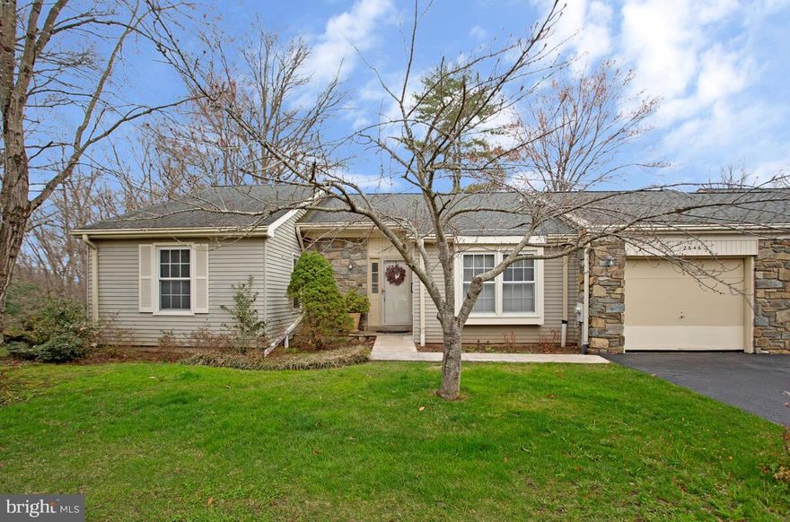 Popular, one level floor plan in the 55+ community of Heritage Harbour offering just the right amount of space to enjoy the next phase of your life. You will feel right at home when you turn into this lovely, cul de sac with mature trees and attractive, brick or stone front homes. Pull into your one car garage with automatic door opener & immediate access to the kitchen for easy unloading of groceries or leave the car in your dedicated driveway. There is also overflow parking just across the street. Step into a bright entry foyer and kick off your shoes.  Light the fire in your Woodburning Fireplace with Mantle the large living room with gleaming hardwood floors and grab a hot or cold  drink to relax with. Large eat-in kitchen with natural oak cabinets, ceramic tile floor & ceramic tile backsplash. Kitchen pantry with pull out drawers. The washer and dryer are tucked away on the main level near the kitchen, so if you have a few minutes while dinner is cooking you can fold a load of laundry. This home offers a sliders to the deck from the sunken Den off the Living Room which could be used for whatever your interests are: crafts, reading, music, or a spot for your family to call their own when visiting. There is a large, primary bedroom with it's own en suite private bathroom offering a convenient, walk-in shower and spacious vanity with a double sink as well as access to the covered & screened porch The architecturally shingle roof is only a few years old. Neutral carpet has been installed in the  bedrooms hallway & den. There's also a huge (700 sq ft+)deck "L" shaped deck  & covered & screened porch off the main level. Perfect for entertaining! The lower level boasts an enormous 25' x 16' Family Room with newer carpet as well as an office & Walk-in closet/storage room. The combination of the office + walk-in closet could constitute a 3rd Bedroom in the lower level. Sliders off the basement, so on temperate nights you can walk out the lower level Family Room to your private, rear yard and lower patio to enjoy the outdoors. There is a Carrier Weather Maker 9200 92% efficient gas furnace in the utility & newer water heater. Heritage Harbour has fabulous amenities that include access to boating on the South River, Indoor and Outdoor swimming, workouts in the fitness center, a private, Executive Golf Course, putting green and Pro Shop, tennis & pickleball courts, walking paths, classes, organized groups, activities and travel. You will never be bored here! Get your buyer's agent to arrange a private tour of the Community!