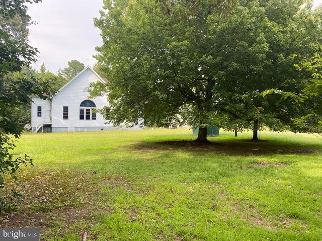Motivated seller says bring your offers!!
Brilliant lot, situated five minutes from your choice of local, lovely private beaches and the local marina to more your boat. This is an “AS IS” sale of the 2 acre parcel with buildings in deteriorated condition located on. There is septic, a well, and a newer electrical service on sight. Sale will include a 40'x8’ high boy shipping container, and any construction materials on site. (This to include a large amount of newer construction staging.) Just minutes away from local restaurant to treat your self after a hard day’s work on this precious piece of ground. 4000sf 1920’s built cinder block and brick foundation on the church to build an incredible new home! Just 5 minutes to the water this lot has many possibilities and is ready for your vision! Value is in the land.