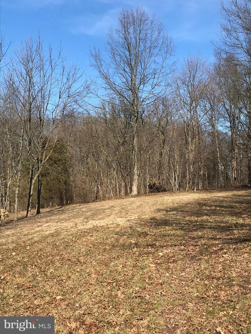 COUNTRY LIVING at it's finest complete with gorgeous views of the South Mountains!   Located between Dillsburg (Route 15) and York with an easy commute to Carlisle, Camp Hill, Mechanicsburg, Harrisburg, Gettysburg or York, this 2.3 acre lot is a perfect place to build your home!  The cleared open area provides an ideal building site complete with a stand of white pines on one side and maple trees on the other.   Perc-approved - see attached documents for on-site septic system.  On-site well required.   Rural Residential & Woodland Preservation Zoning.  Bring your builder - NO building restrictions.  Driveway access is in place.   This is the perfect time to start building your dream home!